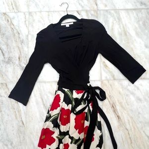 Diane Von Furstenberg wrap dress in red flower pattern. Hourglass extenuating.